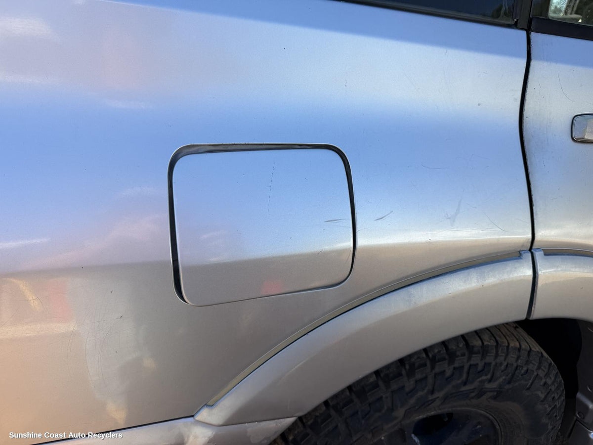 2002-2006 Mitsubishi Pajero Fuel Door Filler