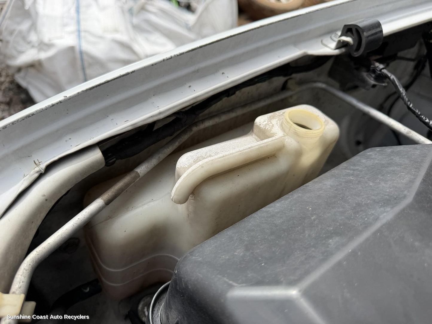 2006-2015 Mitsubishi Triton Overflow Bottle